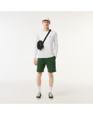 Lacoste Bandolera pequeña con monograma estampado